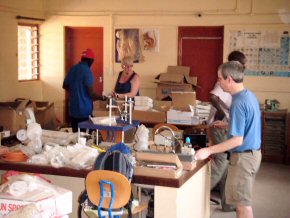 unpacking - Chris with Abdoulie, Anne and Wandifa at Gambia College