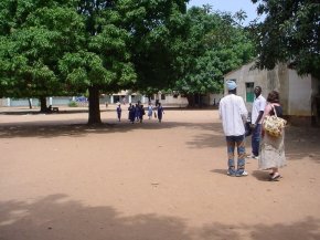 Mo Dawkins talks to members of the staff in the school grounds