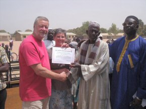 Headteacher, Mr Fatty, presenting Sue and Phil with a Certificate of Appreciation