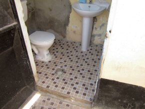 new tiled floors in one of the two toilets