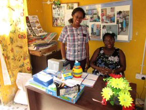 headteacher (seated on the right) in her newly tiled office