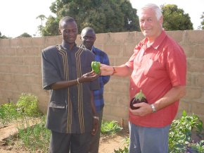 Ian is presented with a green pepper by the headmaster