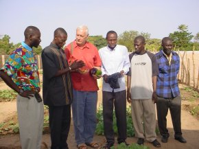 a group photgraph showing Ian, the headmaster and the teachers who look after the vegetable gardens