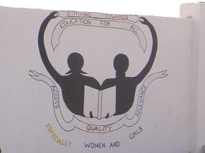 this panel shows two stylised figures and slogans emphasising education for all - especially women and children